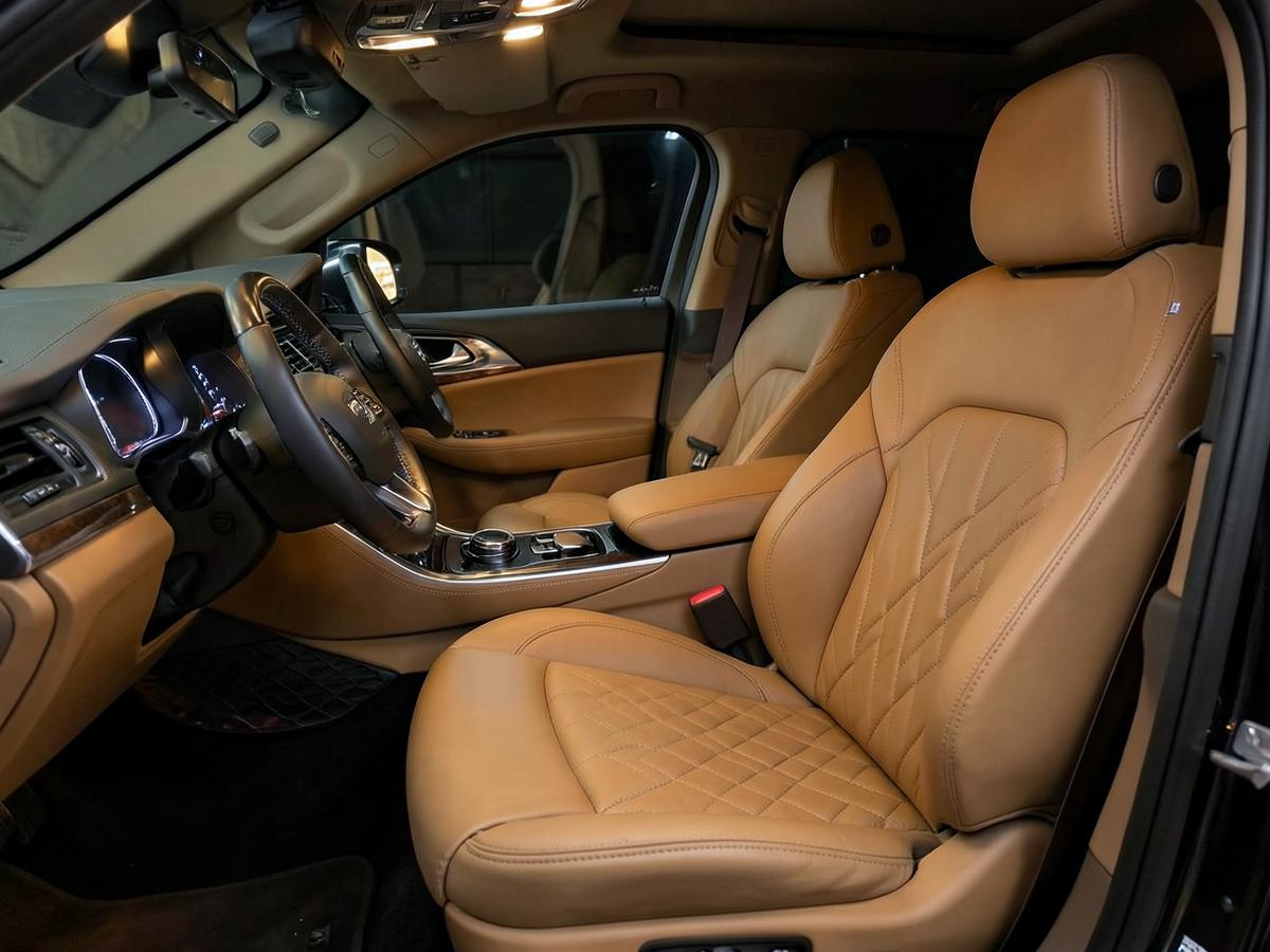 Quilted tan leather interior of a luxury SUV